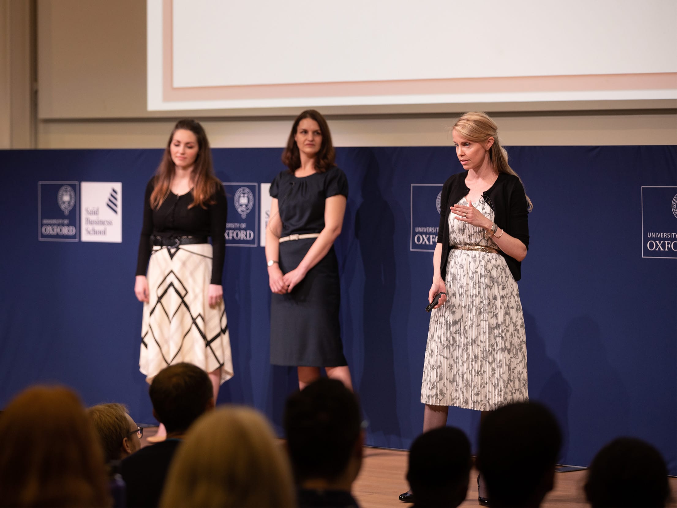University of Oxford's finalists, team daughters presenting on stage