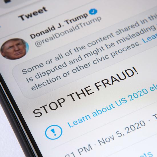 Screengrab of tweet by Trump alleging voter fraud, showing Twitter warning flag